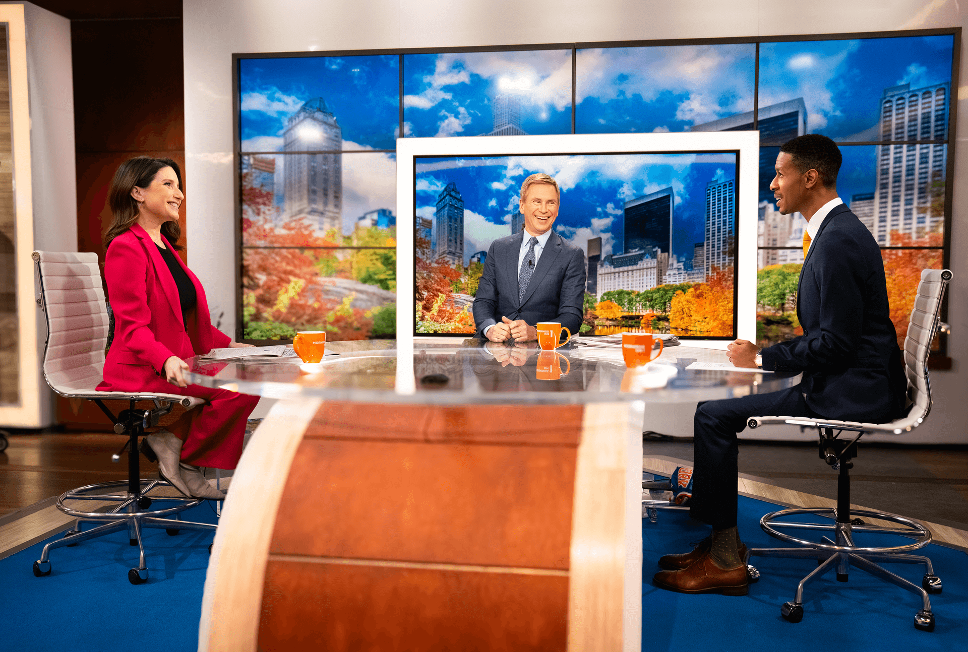 Spectrum News anchors at desk