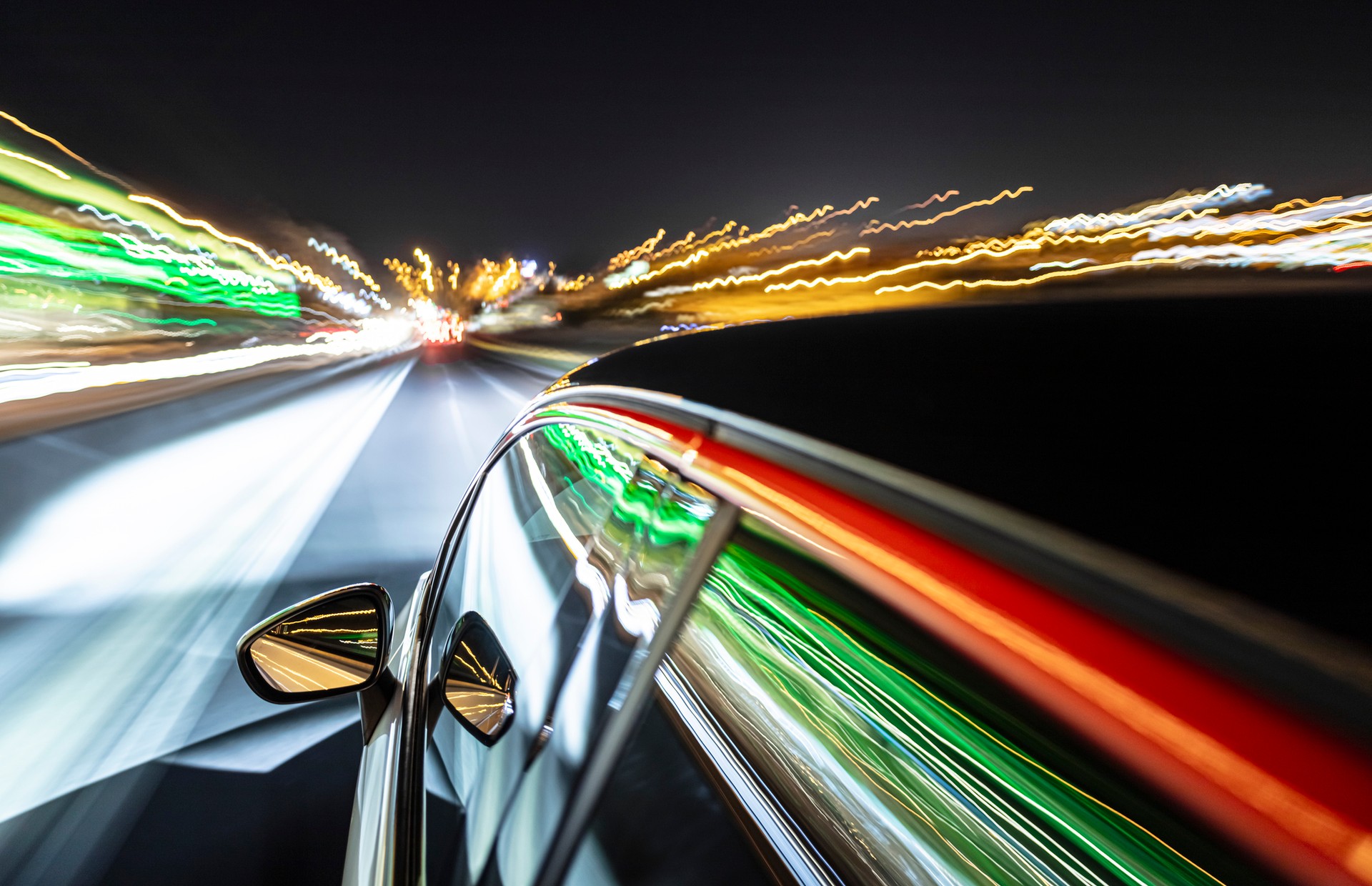 car driving at night with many interesting reflections.